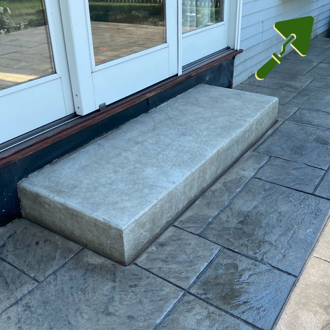 Concrete step at a patio door on a stamped concrete patio, Eau Claire
