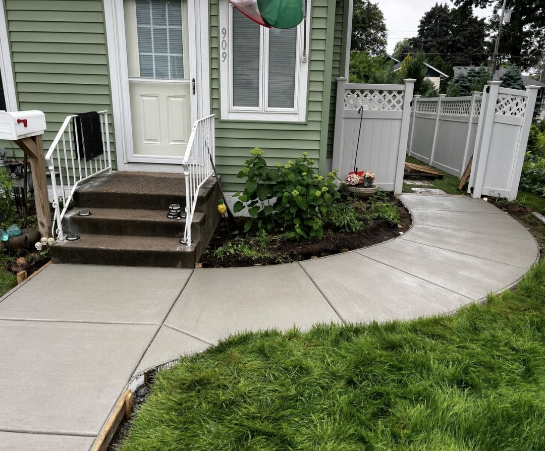 Curved concrete sidewalk leading to a home's front steps, Eau Claire WI